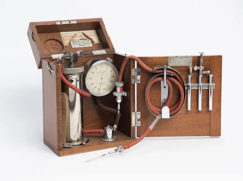 wooden box open holding portable pneumothorax apperatus