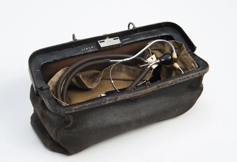 Open leather doctors bag with instruments visable