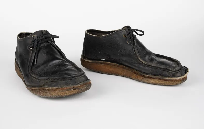 Photo of black Nomad shoes from Puke Ariki's collection